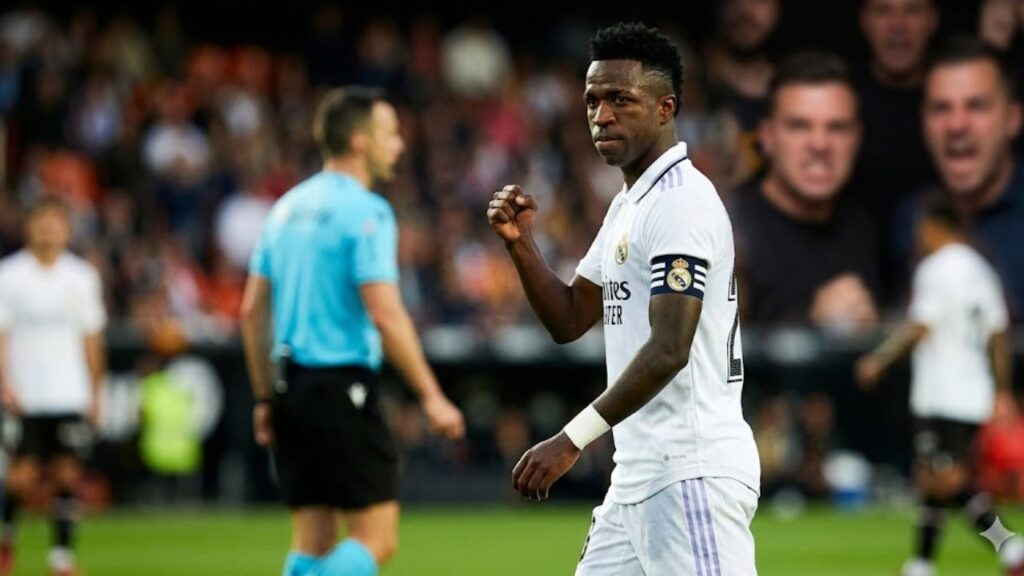 Vinícius Júnior Real Madrid football star in stadium emotional moment after FIFA racism ruling.